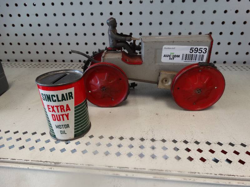 lot 5953 image: Old tractor and change holder