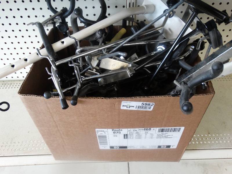 lot 5982 image: Large lot guitar peg board stand & saxophone stand