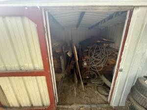 lot 1086 image: CONTENTS OF BUILDING  USED LUMBER  GARDEN HOSE