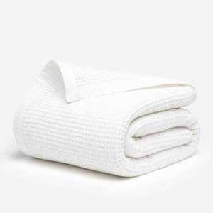lot 17639 image: Salt Earth GOTS Certified 100% Organic Cotton Throw Blanket, 60 X 80 Waffle Blankets & Throws for Bed, Throw Blanket for Couch, Modern and Cozy Blanket, All Seasons, Comfy Soft Blanket (Snow White) - Retail $48