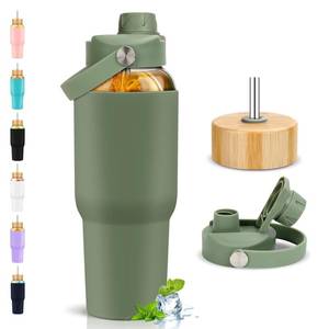 lot 16413 image: PROBTTL Glass Water Bottles 32 oz, 1 Liter Glass Tumbler, Borosilicate Water Bottle with Straw, Silicone Sleeve, 2 Lids - Handle Spout & Bamboo Straw Lid, Fits Car Cup Holder - Retail $24