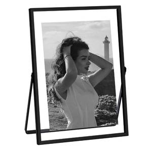 lot 10469 image: eletecpro 5x7 Metal Picture Frame with Real Glass Cover, Tabletop Display Photo for Multiple Size up to 5x7, Black Floating Photo Frame Diaplay 2x3, 3x5, 4x6 for Wedding, Party, Home Decor, Vertical - Retail $14