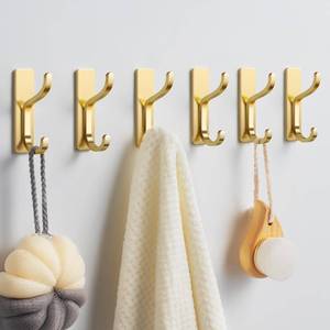 lot 18477 image: Gold Adhesive Wall Hooks for Hanging Brushed Gold Stainless Steel, 13LB Strong Hold Sticky Hangers for Coats, Towels, Bags, Keys - Bathroom, Kitchen, Door, Shower, Dorm, RV - 6 Pack - Retail $11