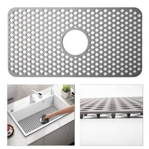 lot 4444 image: TwinnekYR Silicone Sink Mat, 24.6ftftx 12.9ftft Kitchen Sink Protector Grid for Bottom of Center Drain Sink, Gray Non-slip Heat Resistant Liner for Farmhouse Stainless Steel Porcelain Sink - Retail $20