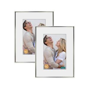 lot 1203 image: DECANIT 8x10 Picture Frame Metal,Thin Profile Photo Frame 8 by 10 Inch, Display for Wall Mounting or Tabletop Pack of 2,silver - Retail $20