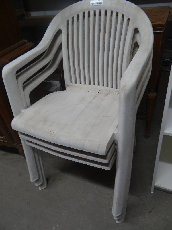 lot 4215 image: 4 Plastic patio chairs.