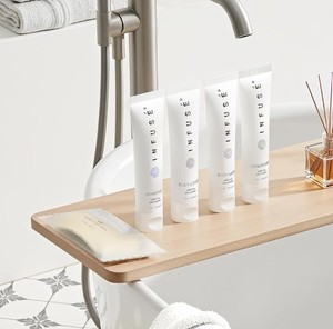lot 100087 image: FACTORY SEALED - Infuse White Tea Coconut Amenity & Accessory Kit
