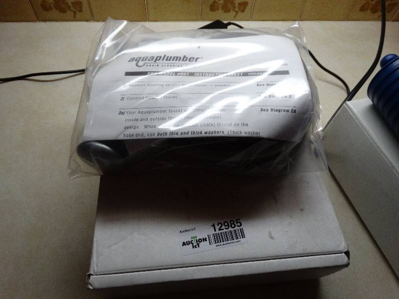 lot 12985 image: Aquaplumber- Drain cleaning tool- New in box