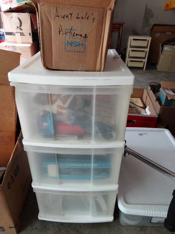 lot 13519 image: Plastic container with 3 drawers on wheels and contents.