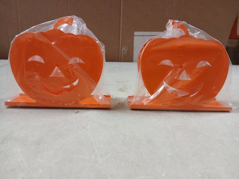 lot 42325 image: 2 Piece Metal Halloween Pumpkin Face Napkin Holders