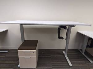 lot 20010 image: Humanscale&nbsp Height-Adjustable Desk with Cushioned File Cabinet