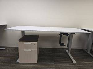 lot 20020 image: Humanscale Height-Adjustable Desk with Cushioned File Cabinet