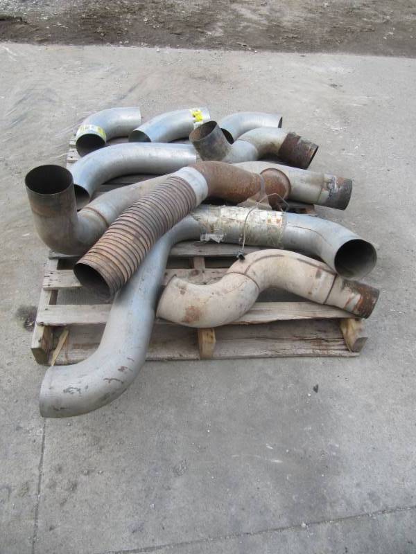 lot 312 image: Mostly New Pallet full of  5  Exhaust Elbows and Pipes and on Turbo Mount