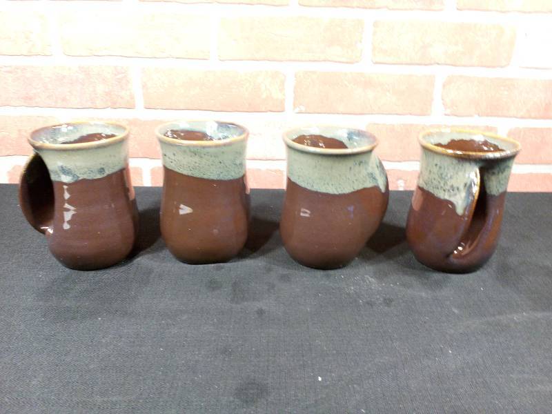 lot 62 image: Clay In Motion Left-Handed Hand Warmer Mugs