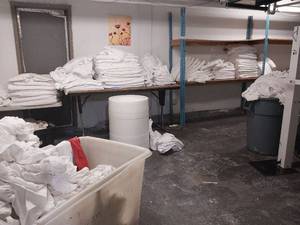 lot 9663 image: Commercial Storage Tables, Racking, and bins with White Textiles  - Retail $800