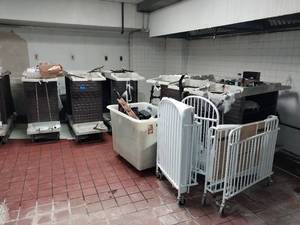 lot 9996 image: Lot of 12 Rubbermaid Housekeepingk Carts, 2 portable cribs, luggage racks, ironing boards, organizers and more  - Retail $8500