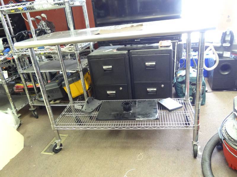 lot 7379 image: Stainless Top Table with Bottom Shelf on Casters