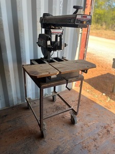 lot 1499 image: Craftsman 10 Radial Arm Saw on movable shelf