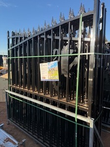 lot 1355 image: 2025 approximately 14 feet Bi Parting Iron Gate with Lion - This lot is a left and right side gate