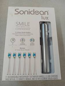 lot 57434 image: Soniclean Lux Electric Toothbrush Set with 6 Brush Heads - Retail $89