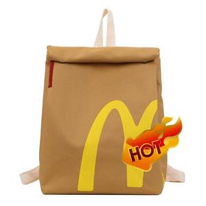 lot 16473 image: JBIUVBTY Classic Funny Retro Paper Bag Large Capacity Backpack Cute Personalized Shoulder Crossbody Canvas Backpack Notebook - Retail $30