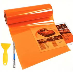 lot 4455 image: KOMAS 12� X 48� Tint Vinyl Film Sticker Sheet Roll for Car Headlight, Tail Lights, Fog Lights with Squeegee  Cutter (Glossy Orange) - Retail $7