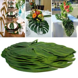 lot 2169 image: 12 Pcs Tropical Leaves Party Decoration Artificial Palm Leaf, Faux Tropical Green Leaves for Party Decorations Jungle Beach Theme Party Table Leave Decorations (13.7inch) - Retail $13
