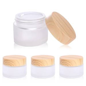 lot 4046 image: 30 Gramml Glass Cosmetic Containers with lidsRound Frosted Glass Jars with Leakproof lids,Small Empty Glass Sample Jars for Makeup Lip Scrub Balm Lotions Sample Eye Creams DIY (4 PACK 30ML) - Retail $10