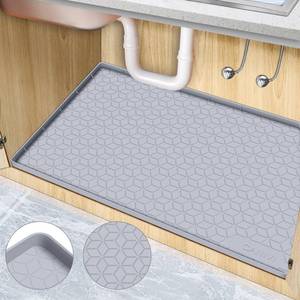 lot 4194 image: CANIVI Under Sink Mat, 34 x 22in Waterproof Silicone Under Sink Tray for Kitchen and Laundry Cabinets, Kitchen Cabinet Shelf Protector, Up to 3.3 Gallons Liquid, Fits 36 inch Standard Cabinet Light Grey - Retail $17in
