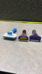 lot 1052 image: Pet Grooming Tool Set - FURminator and Brush Combo