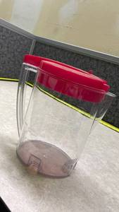 lot 1068 image: Clear Pitcher with Red Lid