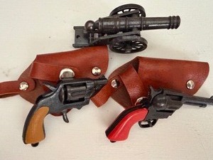 lot 514 image: Miniature Cannon and Guns in Holsters