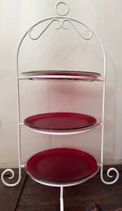 lot 619 image: Three-Tiered Metal Plate Stand w Clear Glass and Red Plastic Dishes