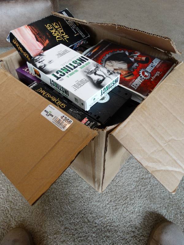 lot 4366 image: Box full of VHS movies.