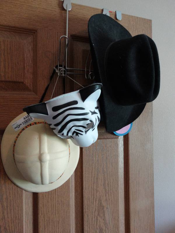 lot 4489 image: Jacketshat hanger wmasks & cowboy hat.