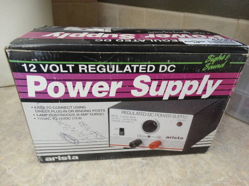lot 4496 image: 12 Volt regulated DC power supply.