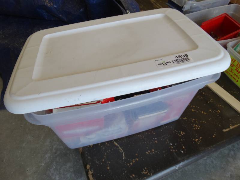 lot 4599 image: Tote of mower parts.