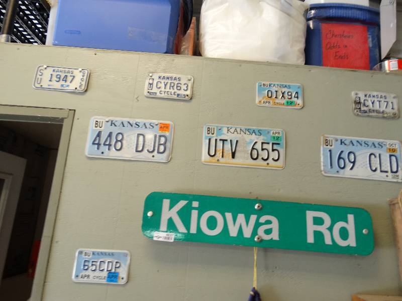 lot 4637 image: Lot of motorcycle license plate & street sign.