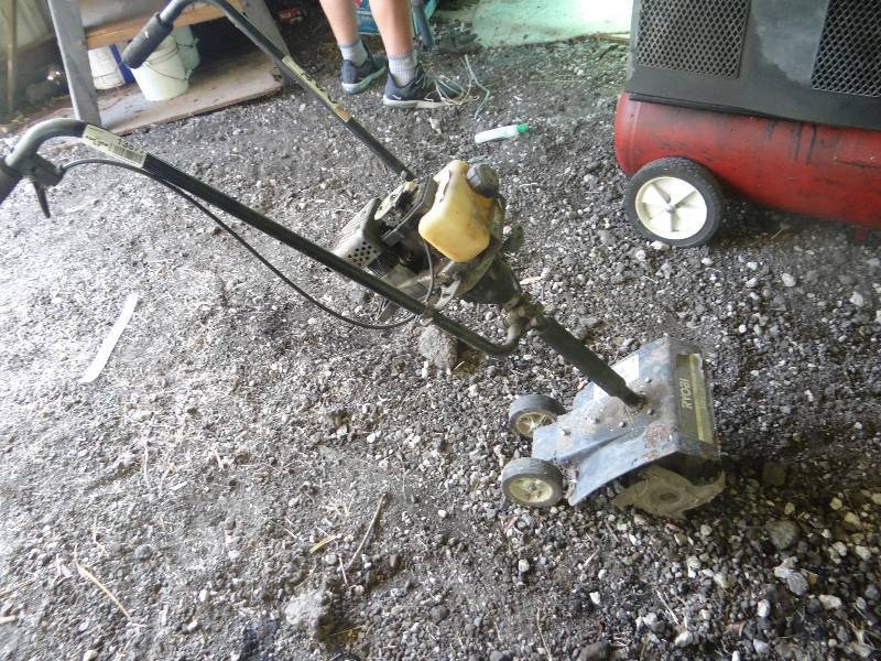 lot 13577 image: Ryobi 410r 31cc- 9 tiller.