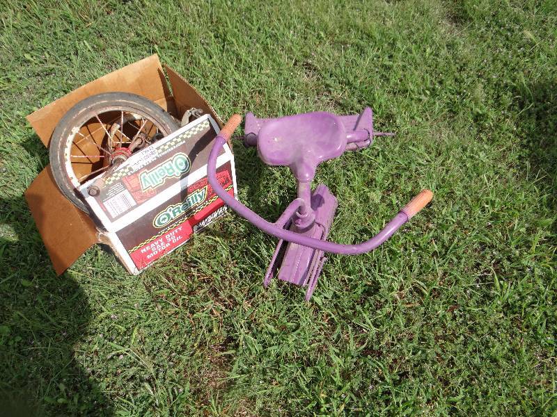 lot 13643 image: Purple tricycle with parts.