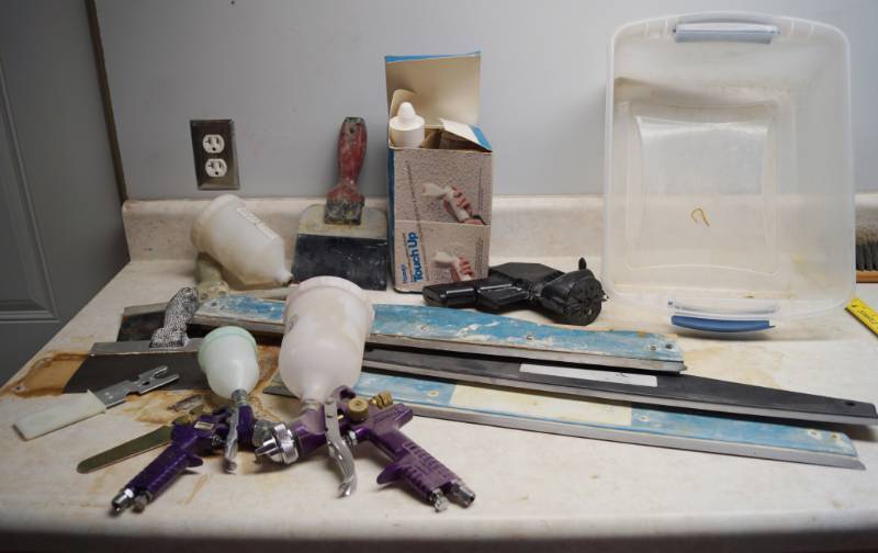 lot 1010 image: Lot of Drywall Items and Paint Sprayers  Accessories w storage tub
