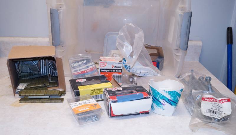 lot 1027 image: Lot of Hardware in a Tub - Staple Gun Staples, Boxes of Nails, Screws, LARGE Bots, Nuts and more