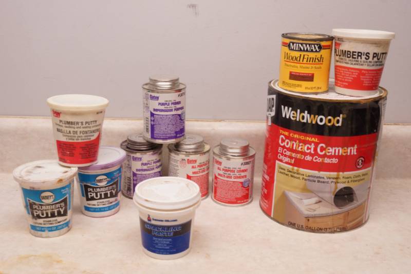 lot 1055 image: Lot of Plumbing Glues, Putty and Contact Cement - see pics