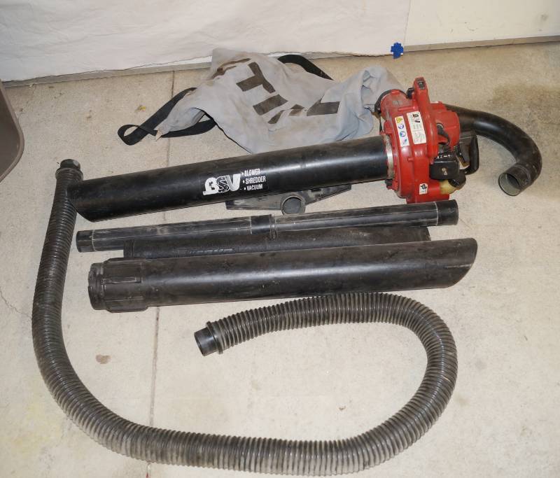 lot 1116 image: BSV - Gas Powered Blower Shedder Vacuum - Working Condition Unknown - w many accessories and a storage tub