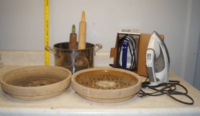lot 1120 image: Lot of 2 clothing irons like new, 2 stoneware plant trays, Cuisinart pot and two rolling pins