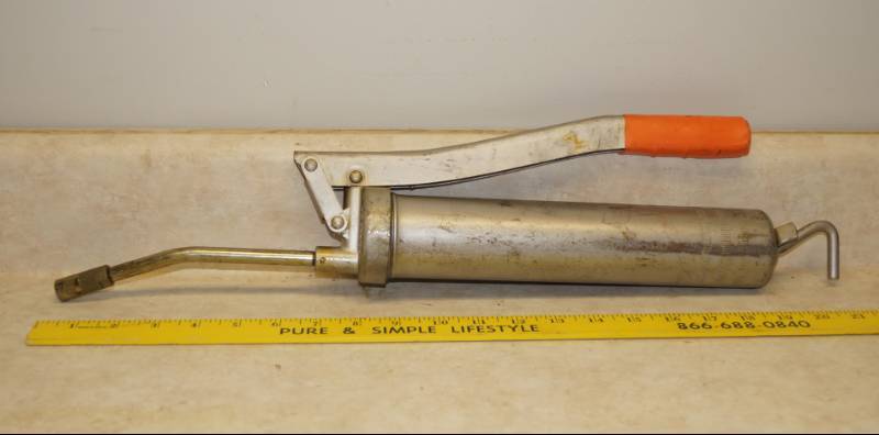 lot 1133 image: Silver Grease Gun w Orange Handle