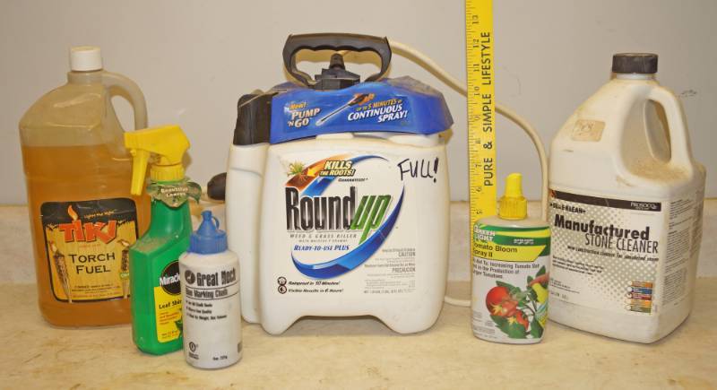 lot 1148 image: Lot of Lawn and Garden Stuff - Round Up (FULL) Stone Cleaner, Tiki Torch Fuel and more - see photos
