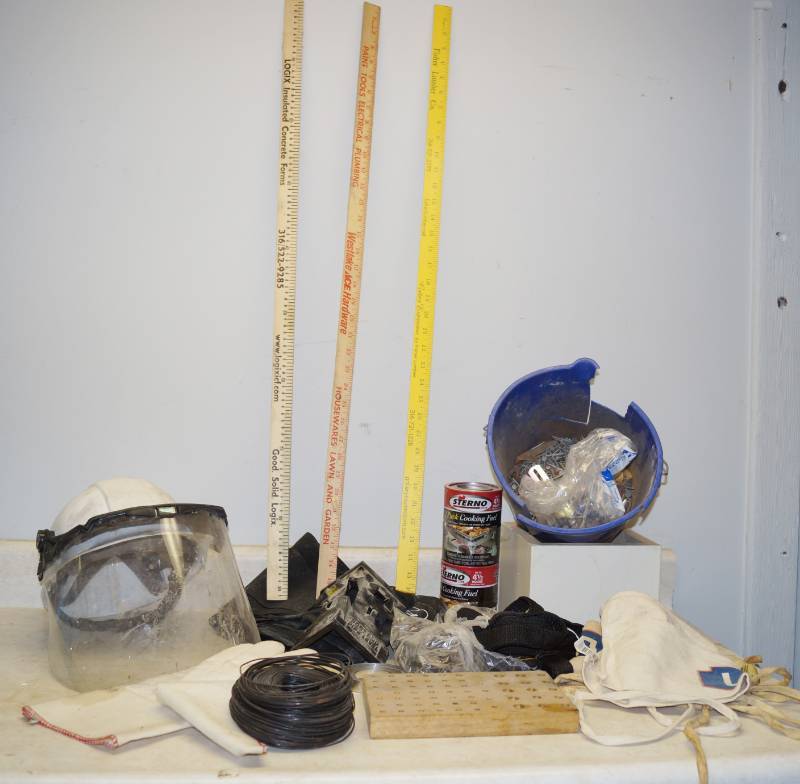 lot 1203 image: Sterno Cooking Fuel, Hard hat w face shield, drill bit tray, hardware aprons, 3 yardsticks and more - roll of wire