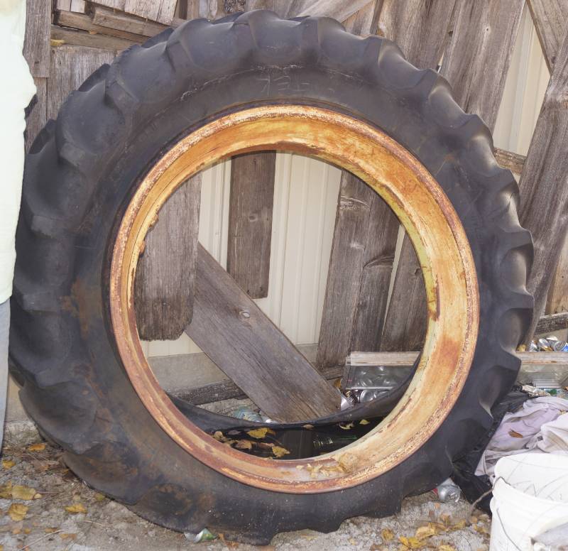 lot 1244 image: BIG Tractor Tire w rim Sand box and Garden Ready
