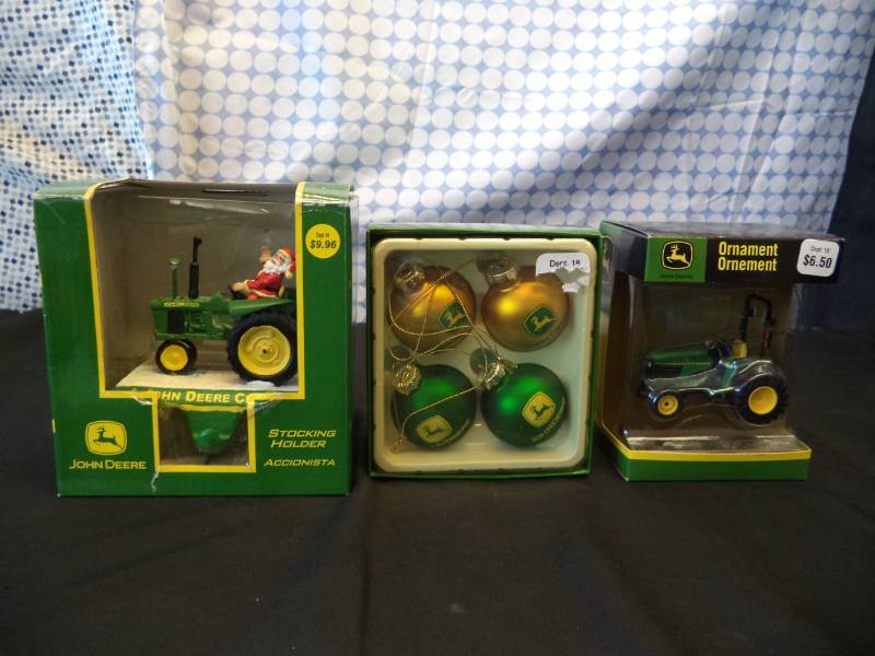 lot 2478 image: John Deere Stocking Holder, 4 glass ball John Deere ornaments, & John Deere tractor ornament
